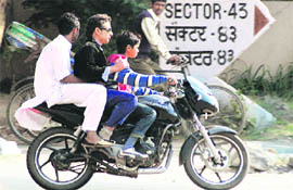 Underage motorcyclists don't care two hoots for traffic rules in Chandigarh.