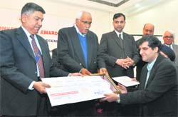 Hemant Kochar receives the Energy Conservation Award in Dehradun on Monday. 