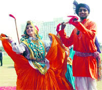 Folk artistes give a performance at the inaugural ceremony of the 32nd National Sub-Junior Football Championship at the Devi Lal sports complex in Gurgaon. Tribune photo: Sayeed Ahmed