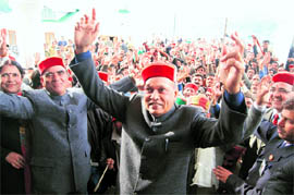 UPBEAT CHIEF MINISTER: Prof Prem Kumar Dhumal performs an Hamachali natti with his enthusiastic supporters who came from Rohru, outside the Vidhan Sabha hall at Dharamsala on Monday.
