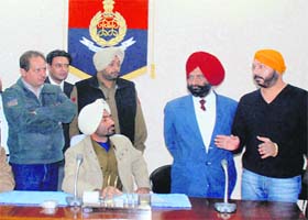 Sadhu (right) apologises for hitting a senior officer at Ludhiana