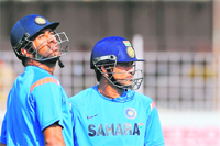Indian captain M S Dhoni (L) and Sachin Tendulkaar during a practice session in Rajkot 