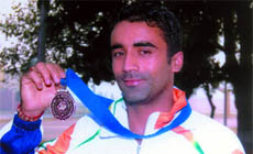 Harpreet Singh displays the medal that he had won during the 18th Asian Athletic Championship held recently in China.