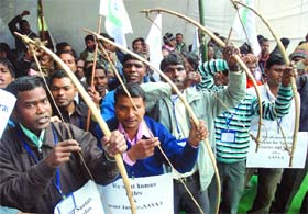 Activists of the All-India Students Association of Assam demand ST status for adivasis during a demonstration at Jantar Mantar in New Delhi on Tuesday.