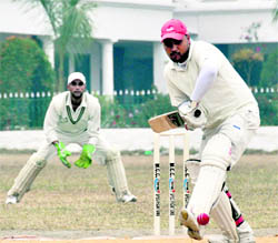 A batsman plays a shot during a match at the 58th DIstrict Cricket League in Dehradun on Tuesday.