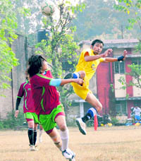 Players in action during a match in the MK Bisht Memorial Tournament in Dehradun on Monday. A Tribune photograph 