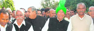 INLD supremo OP Chautala, along with other MLAs, comes out of Haryana Raj Bhawanin Chandigarh on Tuesday.