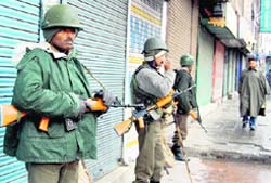 CRPF jawans keep vigil in Srinagar on Tuesday where a bandh call was given by the Majlis-e-Mushawarat