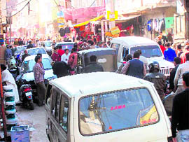 In the absence of traffic policemen, haphazard movement of vehicles leads to traffic jams at various crowded places in Udhampur.