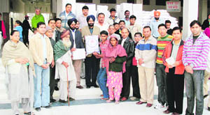 ETO DS Garcha distributes ration among the needy at Jagraon.