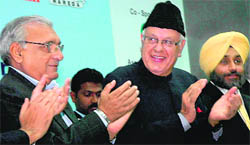 Union Minister for New and Renewable Energy Dr Farooq Abdullah, Haryana Chief Minister Bhupinder Singh Hooda and Punjab Deputy Chief Minister Sukhbir Singh Badal in Chandigarh on Wednesday.