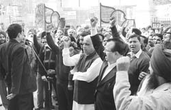 Members of the All-India Bank Employees Association protest in support of their demands in Patiala on Wednesday.