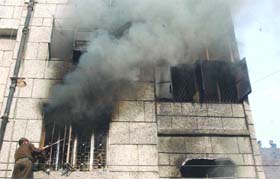 Fire services personnel try to douse a fire that broke out in a godown at Karol Bagh in New Delhi