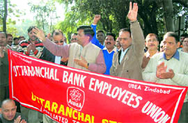 Bank employees hold a demonstration in Dehradun on Wednesday. A Tribune photograph