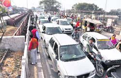 Vehicles caught in a traffic jam on the Jagraon bridge following a protest by safai workers in Ludhiana