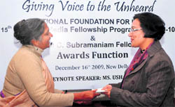 Development journalist Usha Rai awards the media fellowship to Tribune correspondent Chitleen K Sethi in New Delhi on Wednesday. A Tribune photo