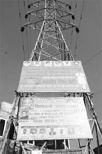 Hoardings put up on an electricity tower in Baltana