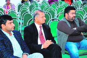 Empty chairs behind bidders at a conference in Chandigarh