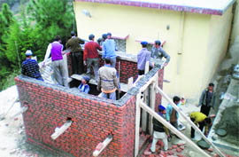 Masons being trained at the Disaster Mitigation and Management Centres training programme in Dhari region of Nainital. 