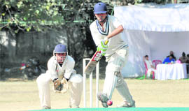 A batsman defends a delivery during a match at the Winter Cricket Festival at Rangers College Grounds in Dehradun on Thursday.