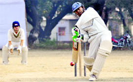 A batsman hits a shot during a match of the Beehive T20 Cricket Tournament in Dehradun on Thursday.