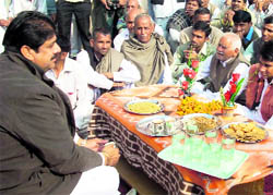 Ajay Singh Chautala addresses people at Jogiwala village on Thursday.