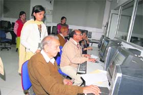 85-year-old Prem Pal Malhotra attends a computer class at DAV College for Girls in Yamunanagar