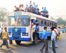 Students travelling on the rooftop of buses has become a common sight in Hisar