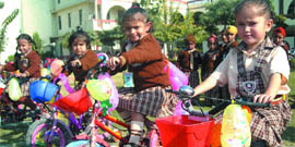 Tiny tots of St Soldier's Kids Paradise participate in a cycle race.