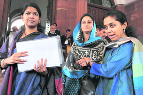 The NCPs Supriya Sule, SAD MP Harsimrat Kaur Badal and DMK member Kanimozhi in support of Women Reservation Bill in Parliament on Thursday.