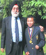 Minister of sports MS Gill (L) with national boxing champion Suranjoy Singh in New Delhi on Thursday. Suranjoy won gold at the recently-concluded Presidents Cup in Baku