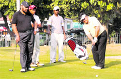 NRI golfers in action on the 18th hole on the opening day of the Chandigarh Golfing Tour at the Chandigarh Golf Club on Friday.