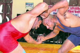 Wrestlers fight in the Zila Kumar Wrestling Competition in Ambala Cantonment on Friday.