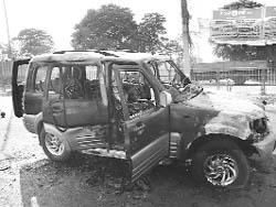 The charred remains of the Scorpio car near the Balongi sales tax barrier in Kharar.