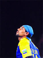 Tillekeratne Dilshan looks to the heavens after completing his century during the second ODI in Nagpur on Friday.  AFP
