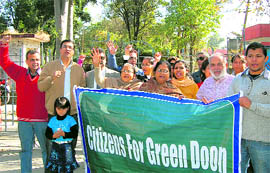 Members of Citizens for Green Doon protest at the Presidents Bodyguards Estate on Rajpur Road in Dehradun on Saturday. A Tribune photograph