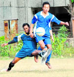 Players vie for the ball during a match at the MK Bisht Memorial Football Tournament in Dehradun on Saturday. A Tribune photograph 