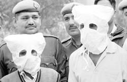 The murder suspects in police custody in Karnal