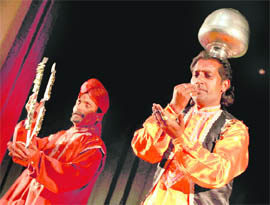 Artistes perform at the folk dance and music festival at Abhinav Theatre in Jammu on Saturday.