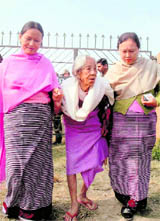 An elderly woman arrives at a polling station to cast her vote for Yaiskul Assembly seat in Imphal on Saturday.