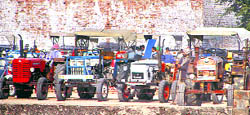 Farmers with their tractors at one of the tractor mandis at Barnala. 
