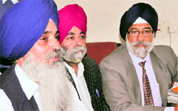 Justice T.S. Doabia (extreme right) in Ludhiana on Saturday.