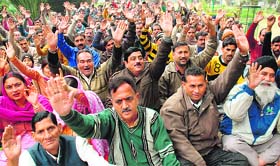 Members of the National Mazdoor Conference protest in support of their demands in Jammu