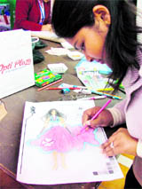 A participant at work during an inter-school fashion illustration competition held in Ludhiana on Sunday.