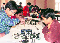 Players concentrate on their game during the District Chess Championship that concluded in Ludhiana on Sunday.