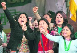 Gorkha Janamukti Morcha members shout for a separate state of Gorkhaland at Jantar Mantar in New Delhi on Sunday. 