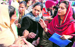 Bathinda MP Harsimrat Kaur Badal (extreme right) interacts with villagers in Naruana village, Bathinda on Sunday