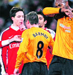 Arsenals Sami Nasri gestures to Hull Citys Nick Barmby during their match in London on Saturday. 