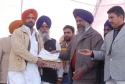 Animal husbandry minister Gulzar Singh Ranike handing over prizes to the winner on the concluding day of the Khetri Pashudhan Mela in Bathinda on Monday.