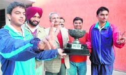 The winning team of Multani Mal Modi College along with the principal in Patiala on Monday. A Tribune photographon Monday.